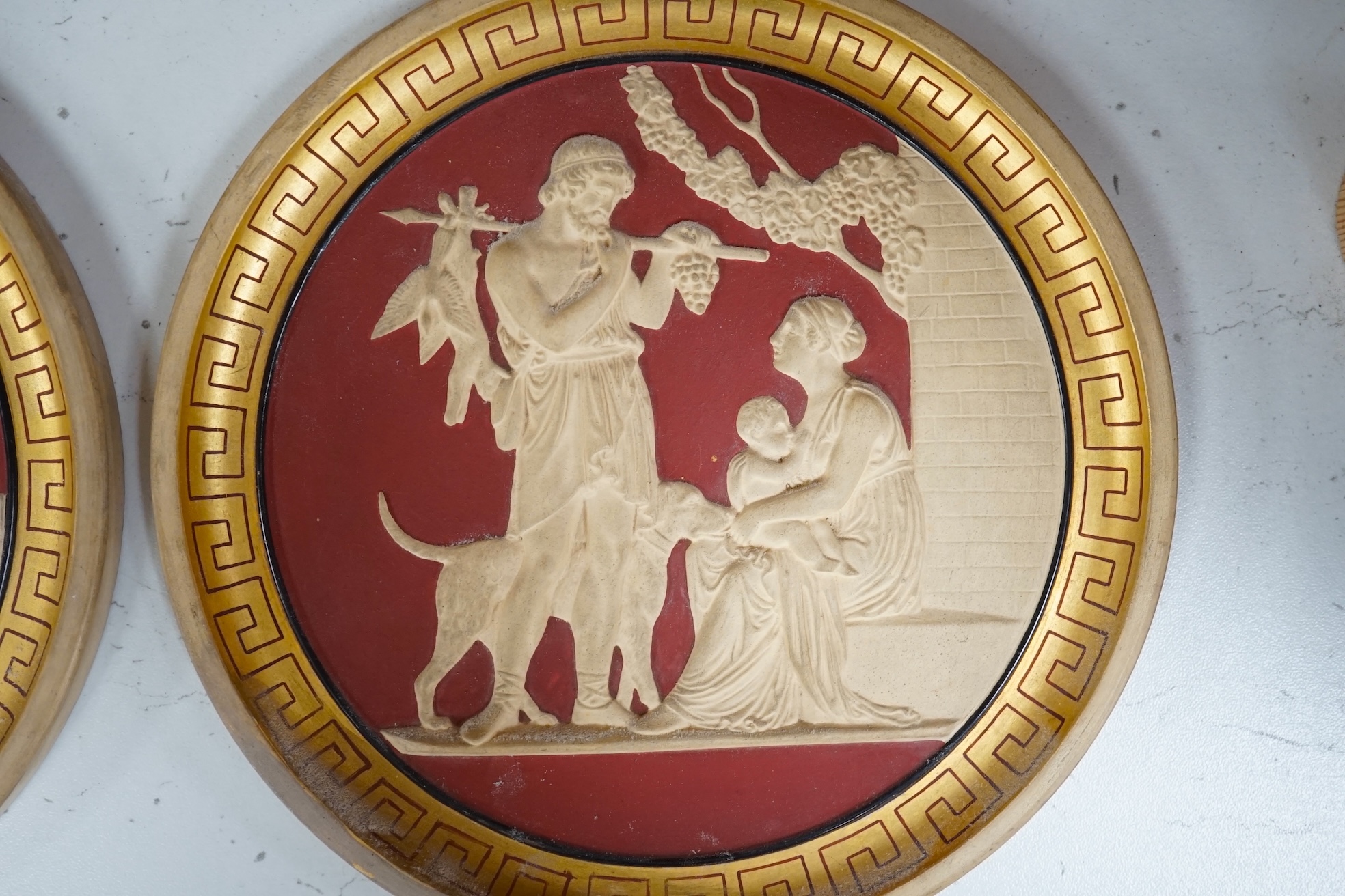 A set of four Neoclassical style terracotta plaques, P. Ipsen, ‘The Four Seasons’, by Bertel Thorvaldsen, each stamped to the base, 17cm in diameter. Condition - some restoration